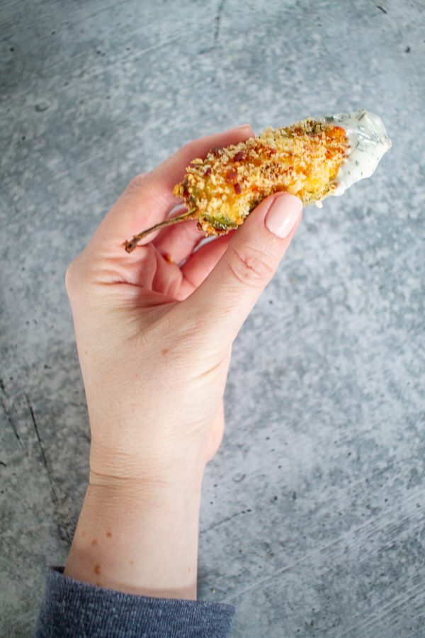 Baked Jalapeño Poppers are filled with cream cheese, cheddar cheese, and Monterey jack cheese, coated in a crispy breadcrumb coating and baked. It's a slightly healthier take on the popular appetizer.