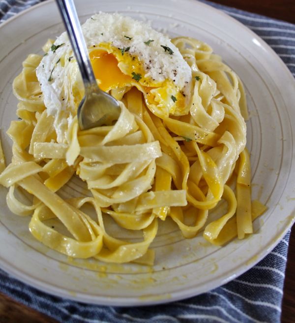 Cream Parmesan Pasta with a Poached Egg - I've found the ultimate brunch for the person who tends to prefer the lunch side of brunch. Inspired by a dish from Nellcote's old brunch menu, I created Creamy Parmesan Pasta with a Poached Egg. It's fresh pasta tossed in a parmesan cream sauce with a touch of lemon, topped with a runny poached egg. This is a sophisticated meal that takes just 15 minutes to prepare. While I think it is a perfect Sunday brunch, it would make a quick weeknight dinner too.