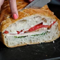 Pan Bagnat, a simple recipe for a giant sandwich to slice and share - via The Kittchen