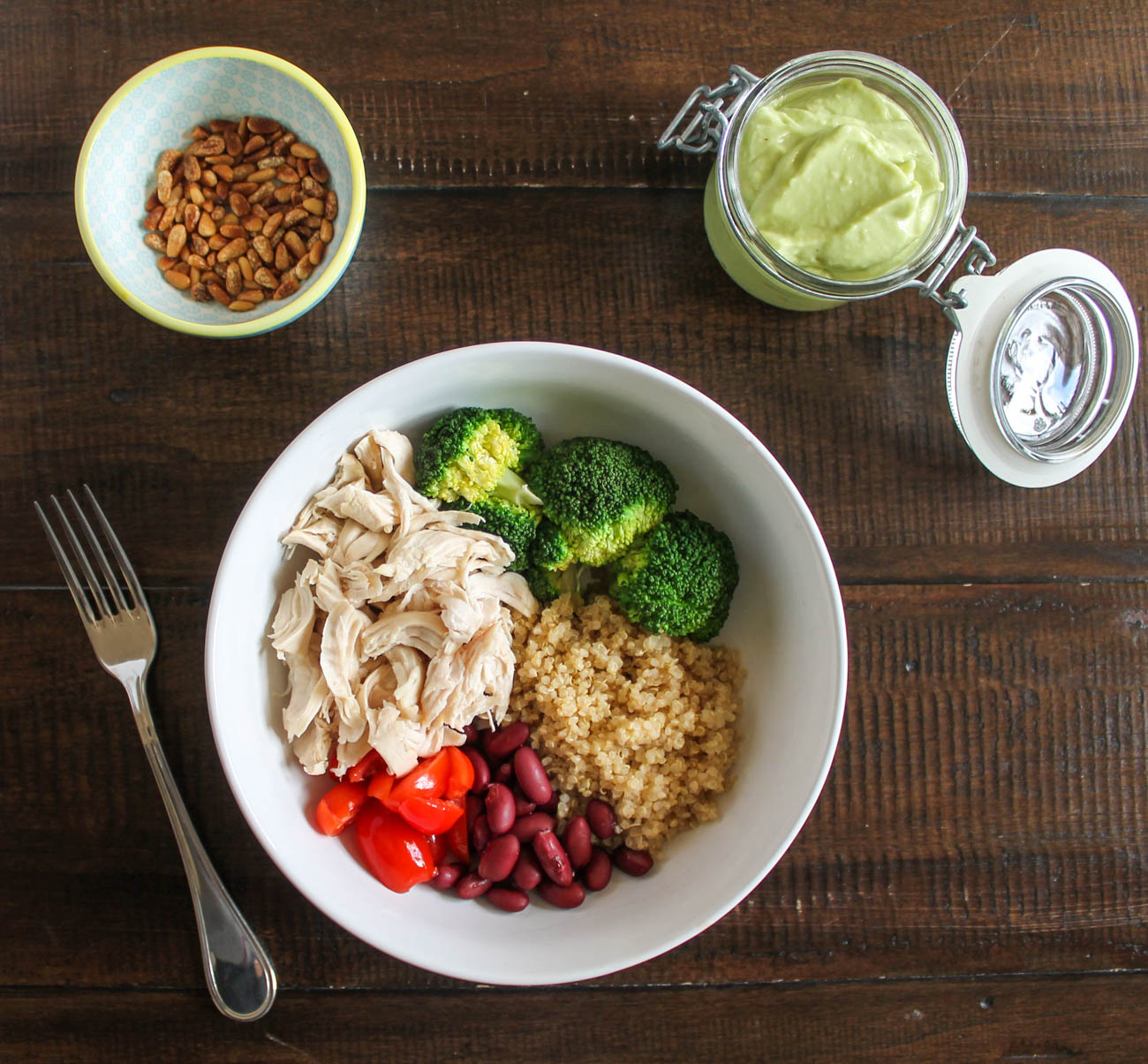 https://thekittchen.com/wp-content/uploads/2016/01/Chicken-Quinoa-Bowl-with-Avocado-Dressing-via-The-Kittchen.jpg