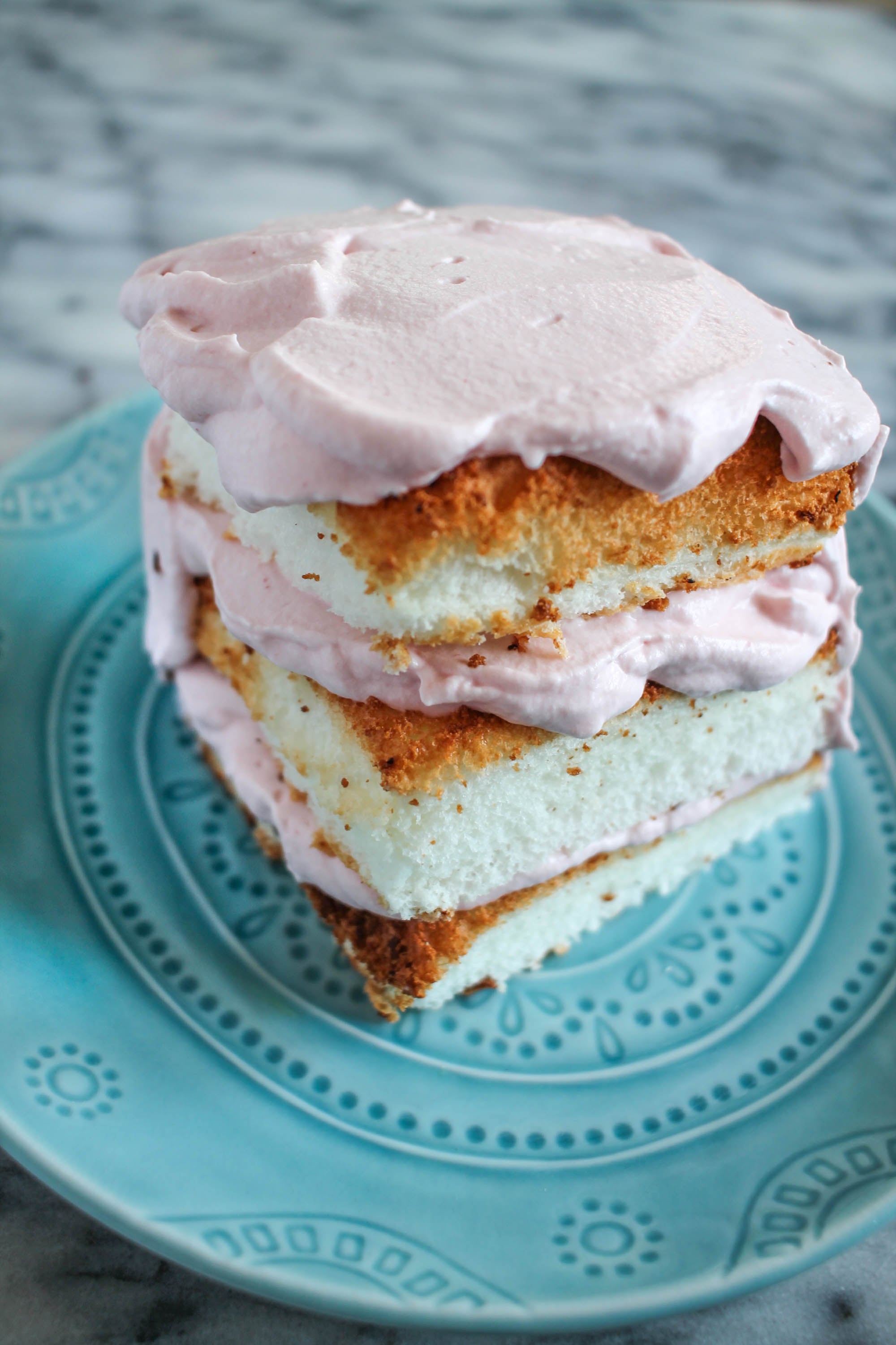 Angel Food Cake with Strawberry Whipped Cream Frosting thekittchen
