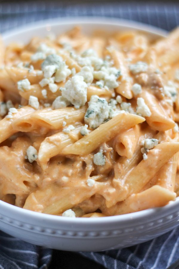 Buffalo Chicken Macaroni and Cheese is cheesy and spicy and loaded with chunks of chicken. It is a perfect 30 minute recipe that uses leftover chicken.