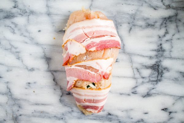 Bacon Wrapped Jalapeño Popper Chicken | This easy to prepare Bacon Wrapped Jalapeño Popper Chicken recipe captures the flavors of one of my favorite guilty pleasure appetizers. The best part is that the active preparation time is just 10 minutes. #dinner #chickenrecipes