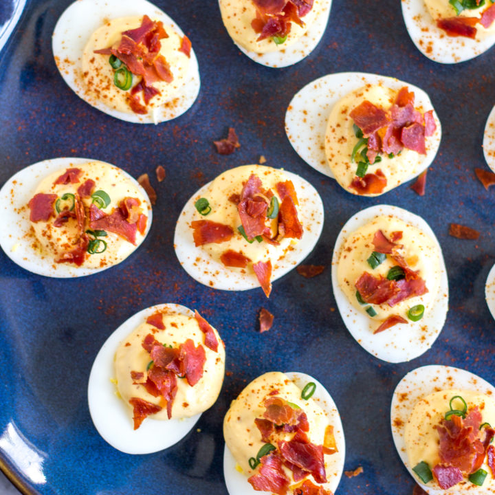 This is the best deviled egg recipe - these deviled eggs have the perfect balance of richness from the egg yolk and mayonnaise plus seasoning from mustard, lemon, and sriracha. A crispy prosciutto garnish makes this recipe extra special.