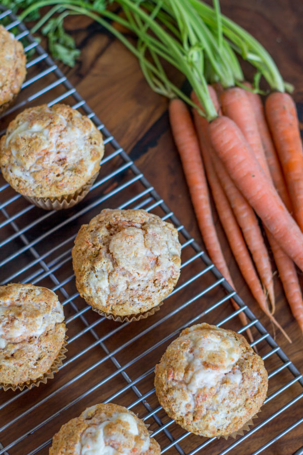 These Carrot Cake Muffins make it acceptable to have carrot cake for breakfast! Just in time for Easter (I hear bunnies like carrots) I am sharing a recipe for moist homemade carrot cake muffins with a cream cheese swirl.