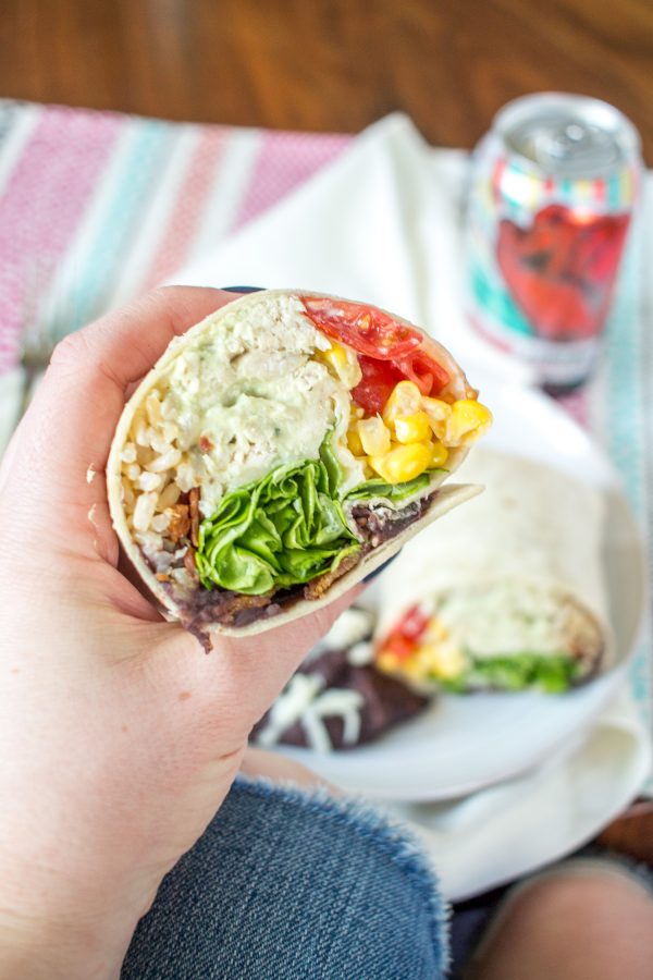 Ranch Chicken Avocado Bacon Burritos - This burrito takes its inspiration from a cobb salad. This wasn't really my intention, it just happened. Corn, bacon, chicken, tomatoes, beans, cheese, and lettuce are all common ingredients in a cobb salad. The same goes for ranch dressing and avocado. It seemed a little odd to add ranch dressing to a burrito, so I made a simple avocado ranch crema and added it to the shredded chicken.
