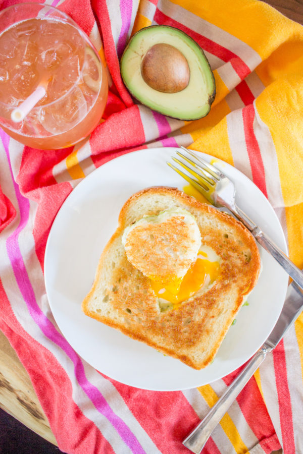 Avocado Cheddar Grilled Cheese Egg in the Hole combines three of my favorite things: grilled cheese, avocado toast, and a sunny side up egg. What more could you want? This meal is the ultimate brunch.
