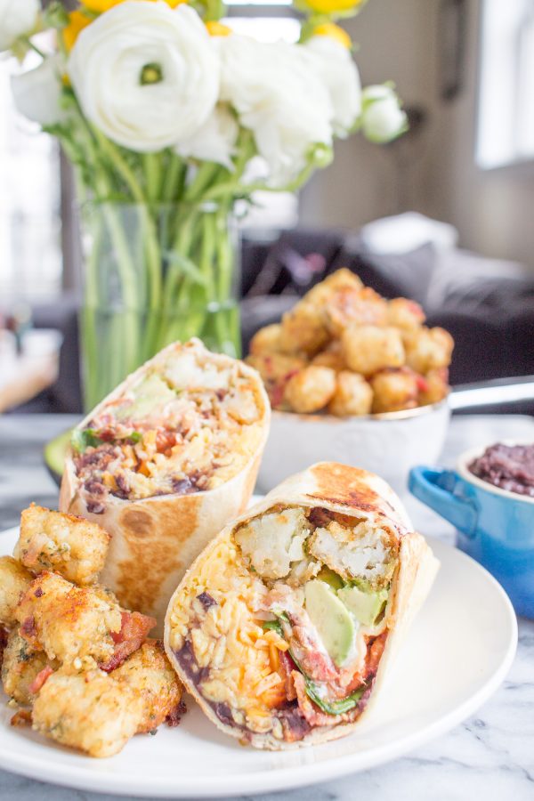 Scrambled Egg and Tater Tot Breakfast Burritos are the ultimate breakfast. You can make them on the weekend and meal prep them to eat throughout the week. They will definitely give you a reason to get out of bed in the morning!