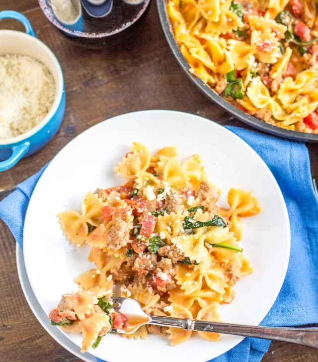 Sweet and Spicy Sausage and Farfalle is a recipe that I grew up eating, and fell in love with again as an adult. It is one of the easiest recipes you can ask for, and the speedy preparation time makes it a perfect weeknight dinner option.
