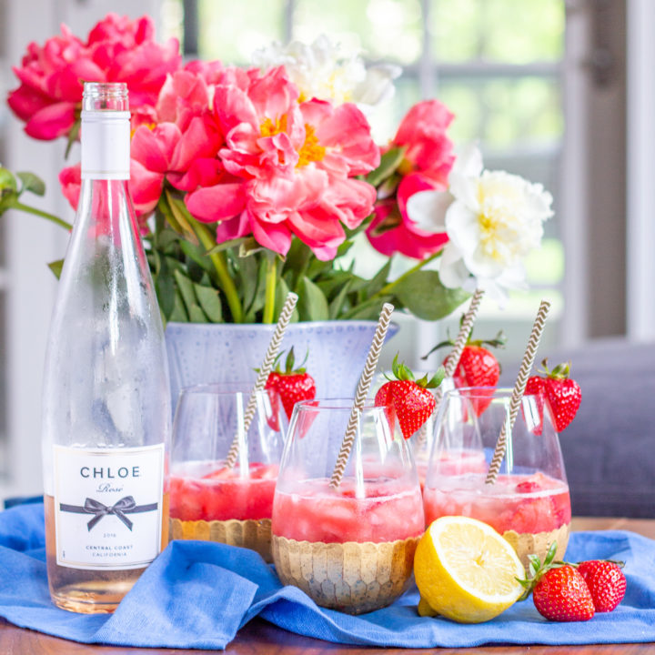 How to Make Rose Sangria | Strawberry raspberry puree, fresh strawberries and raspberries, vodka, lemon juice, and rosé come together to create a fresh and fruity Rosé Sangria that can be made in just 5 minutes.
