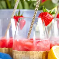 How to Make Rose Sangria | Strawberry raspberry puree, fresh strawberries and raspberries, vodka, lemon juice, and rosé come together to create a fresh and fruity Rosé Sangria that can be made in just 5 minutes.