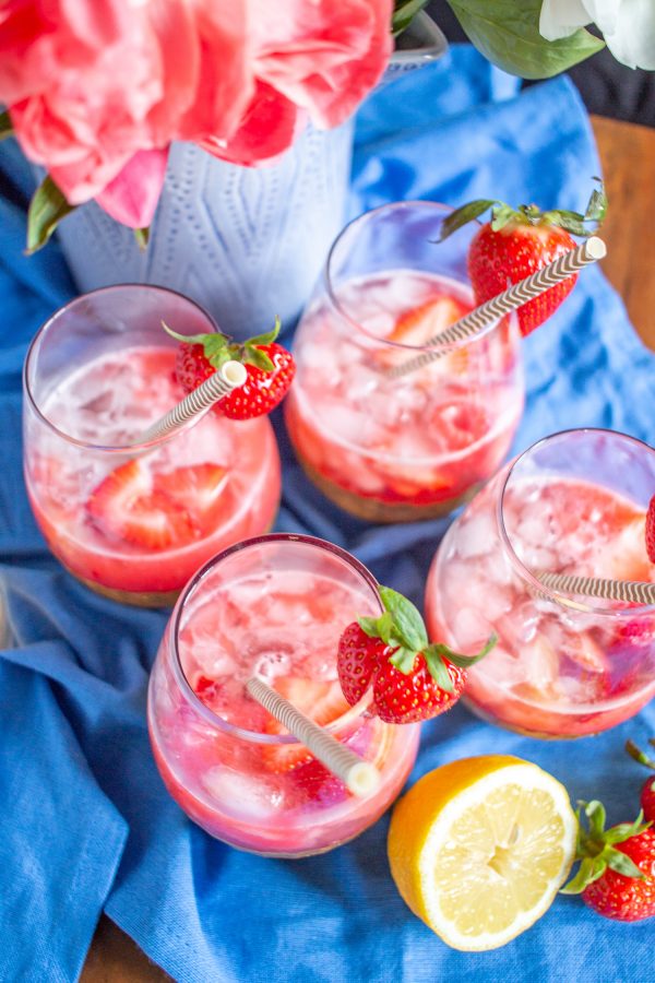 How to Make Rose Sangria | Strawberry raspberry puree, fresh strawberries and raspberries, vodka, lemon juice, and rosé come together to create a fresh and fruity Rosé Sangria that can be made in just 5 minutes.