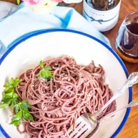 Red Wine Cacio e Pepe is a modern spin on a classic Italian recipe. The pasta is cooked in red wine, giving it a richer flavor.