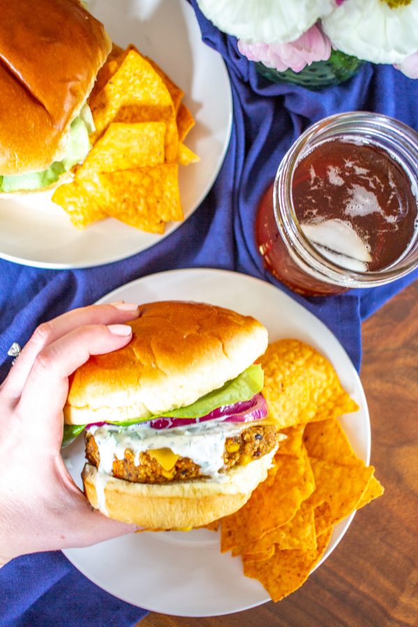 Sweet Potato and Black Bean Veggie Burgers are a great way to eat your veggies. These burgers are made by combining sweet potatoes, black beans, corn, shallots, garlic, quinoa, and old-fashioned oats. It is a plant-based meal that you feel good about eating.