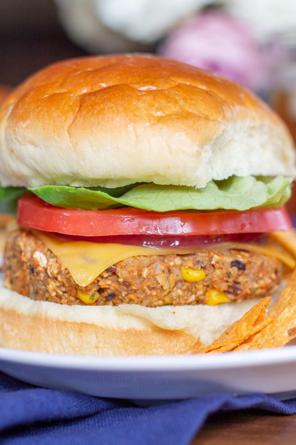 Sweet Potato and Black Bean Veggie Burgers are a great way to eat your veggies. These burgers are made by combining sweet potatoes, black beans, corn, shallots, garlic, quinoa, and old-fashioned oats. It is a plant-based meal that you feel good about eating.