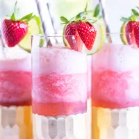 A Gin and Tonic Slushy transforms the classic British cocktail into a refreshing summertime treat. The gin is blended up with plenty of ice and your flavoring of choice (lemon juice, lime juice, and strawberry juice all work well), then you pour that slushy mix into a glass filling it half way and then you pour cold tonic water over and gently stir.