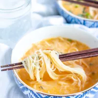 Thai Curry Noodle Soup with Chicken | We are obsessed with this Thai Curry Noodle Soup with Chicken recipe. It's so flavorful - it's spicy, creamy, and citrusy with thin strands of rice noodles and chunks of tender chicken. It is also an easy to prepare weeknight meal that is anything but boring.