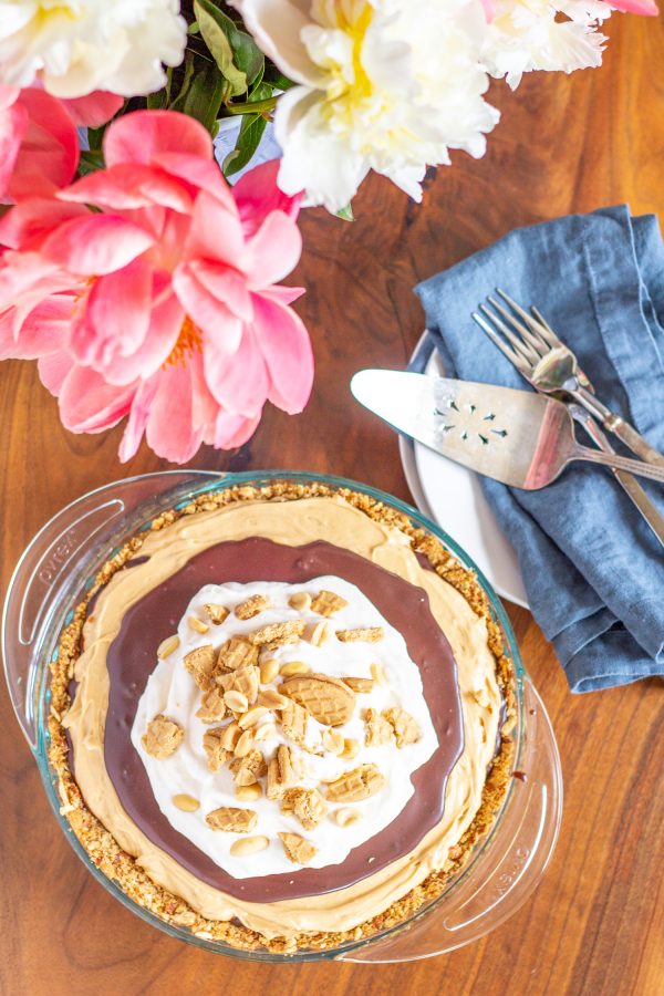 This Chocolate Peanut Butter Pie combines creamy peanut butter, rich chocolate, and light fluffy whipped cream in a salty pretzel crust. The best thing is that this pie comes together in just minutes.