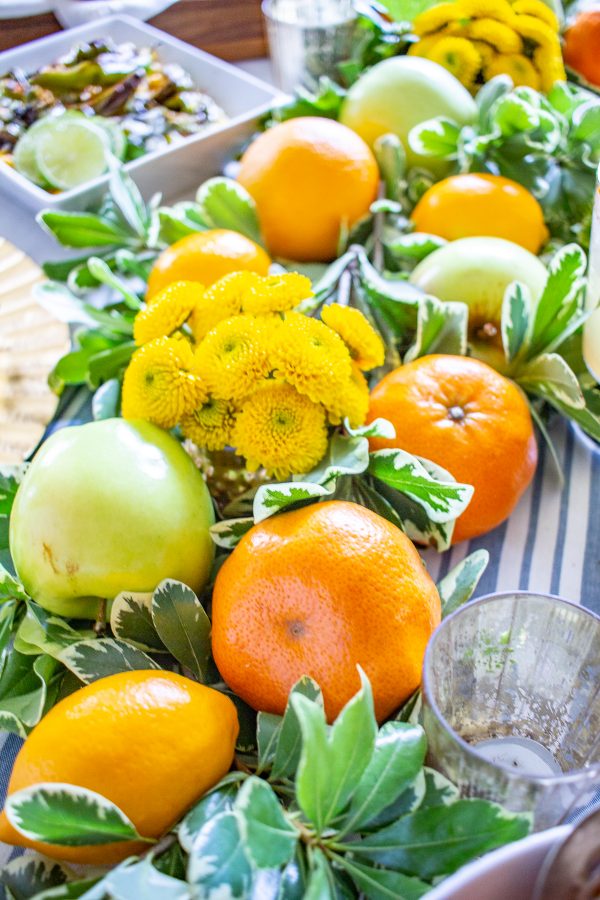 Fresh Fruit Table Setting for Thanksgiving | Learn how to combine greens with fresh fruit to create a festive Thanksgiving tablescape! 