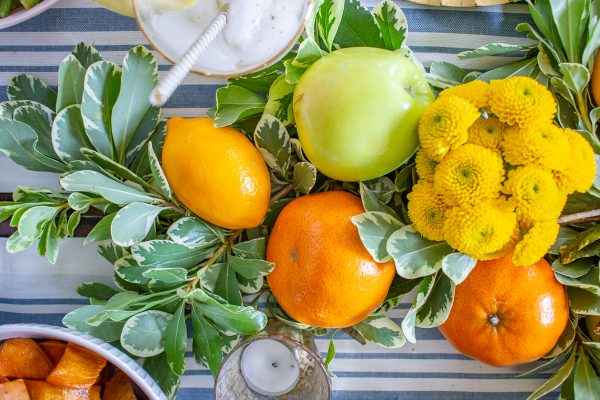 Fresh Fruit Table Setting for Thanksgiving | Learn how to combine greens with fresh fruit to create a festive Thanksgiving tablescape! 