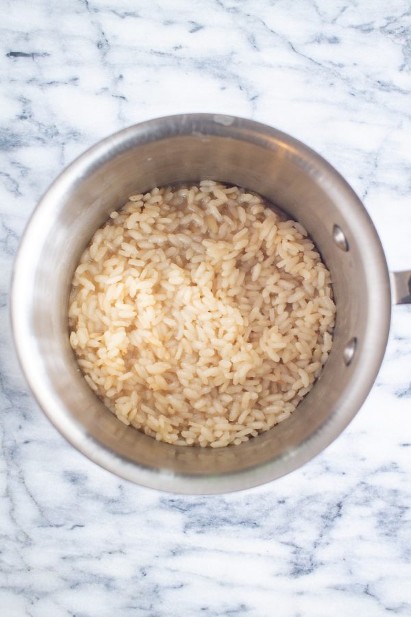  Once the risotto has absorbed the broth, taste it to make sure that it has cooked enough. Then season with salt, and add in any vegetables and cheese that you like.