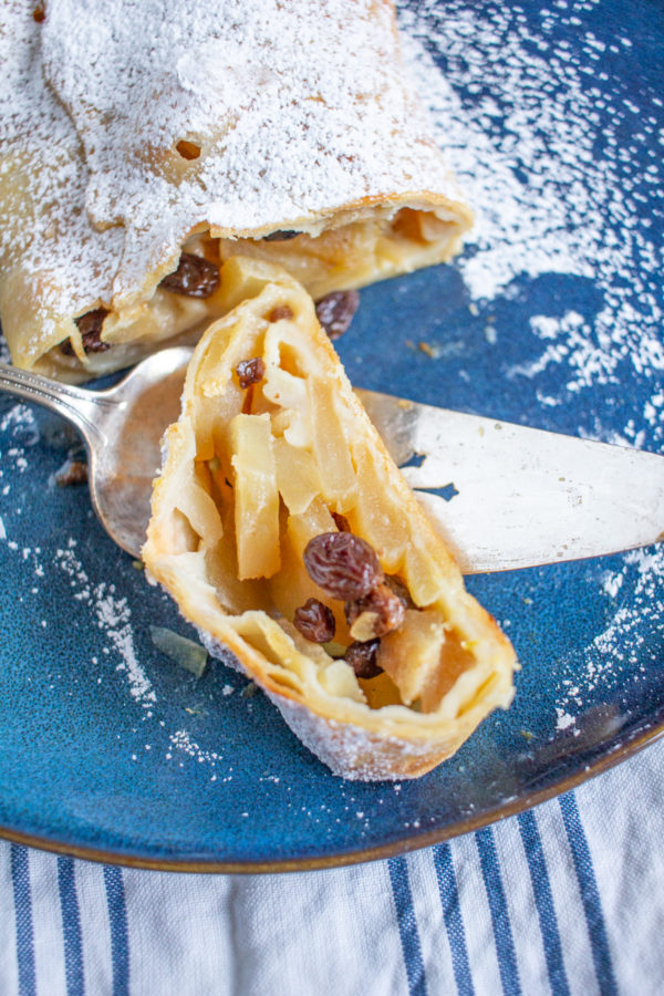 How to Make Apple Strudel | This German Apple Strudel recipe is made with tender apples, crème fraîche, and raisins wrapped up in a light thin pastry.