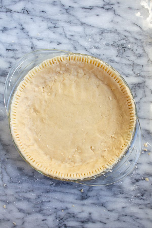 This 4 ingredient no roll pie crust recipe is the easiest way to make a pie crust from scratch! This shortbread pie crust makes holiday baking much easier!