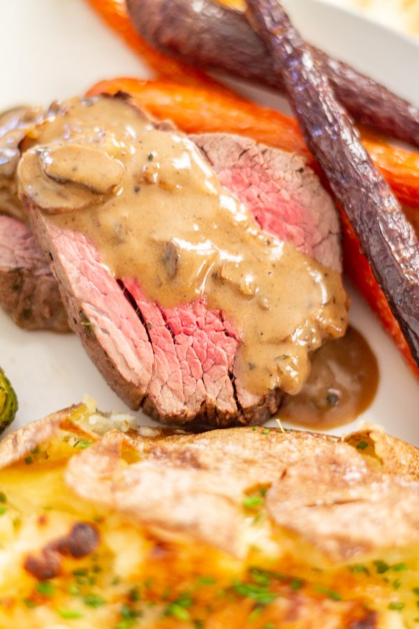 Beef Tenderloin with a Sherry Mushroom Gravy | This 45-minute beef tenderloin recipe has a rich and delicious mushroom sherry gravy with just a touch of cream.