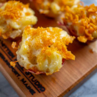 Mac and Cheese Bites | How to make macaroni and cheese bites wrapped with prosciutto and topped with Cheez-It crumbs.