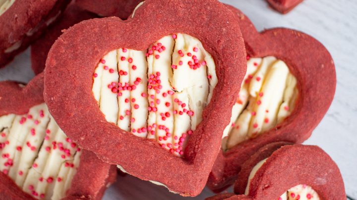 Red Velvet Shortbread Cookies with Cheesecake Filling are a Valentine's Day treat your sweetheart will love. These cookies take the flavor of a red velvet cupcake, and put it into a cookie.