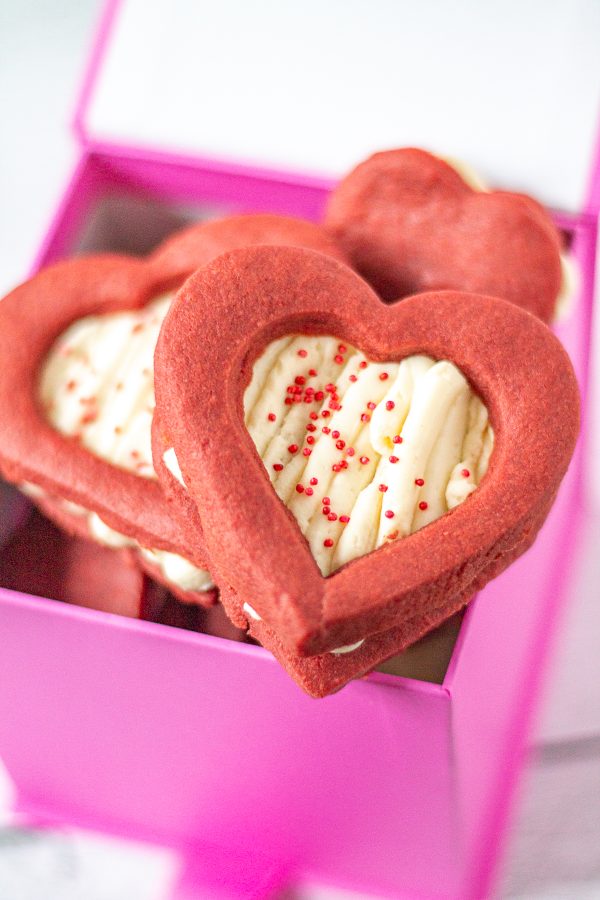 Red Velvet Shortbread Cookies with Cheesecake Filling are a Valentine's Day treat your sweetheart will love. These cookies take the flavor of a red velvet cupcake, and put it into a cookie. 