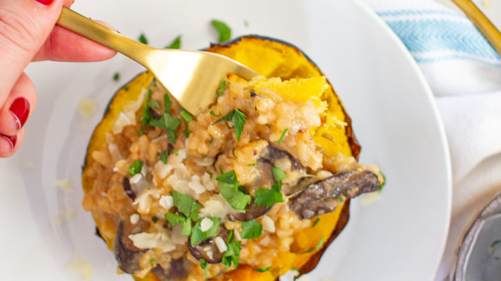 How to make Risotto Stuffed Squash | Risotto stuffed Squash is a hearty vegetarian meal made with roasted acorn squash filled with cheesy risotto.
