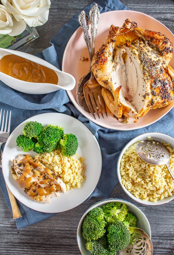 Citrus Roast Chicken Recipe | This easy citrus roast chicken recipe is bursting with flavor. The chicken is seasoned with lemon, orange, garlic, oregano, and basil giving the meal fresh flavors, and the pan drippings make a delicious gravy!