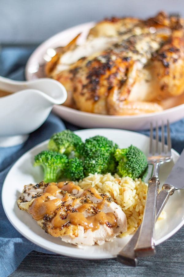 Citrus Roast Chicken Recipe | This easy citrus roast chicken recipe is bursting with flavor. The chicken is seasoned with lemon, orange, garlic, oregano, and basil giving the meal fresh flavors, and the pan drippings make a delicious gravy!