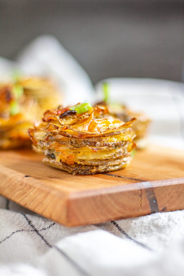 Bacon Cheddar Ranch Potato Stacks are thin slices of potato seasoned with dry ranch dressing and layered with cheddar cheese and bacon. 
