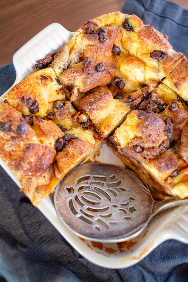 Chocolate Chip Cookie Bread Pudding combines custardy bread pudding and chocolate chip cookies. It tastes like a combination of cake, pudding, and chocolate chip cookies. It's ooegy gooey deliciousness.