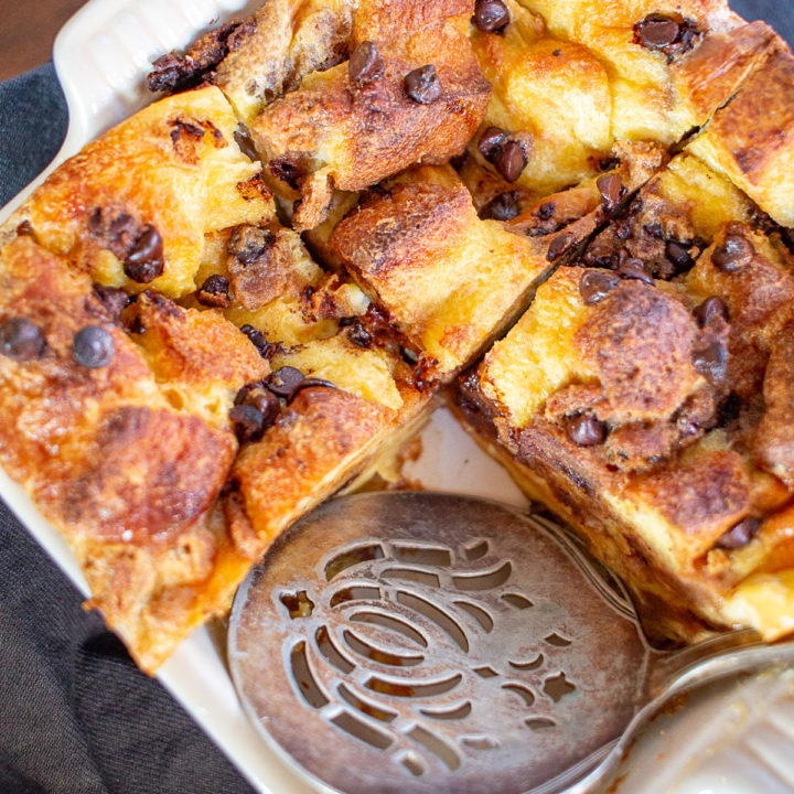 Chocolate Chip Cookie Bread Pudding combines custardy bread pudding and chocolate chip cookies. It tastes like a combination of cake, pudding, and chocolate chip cookies. It's ooegy gooey deliciousness.