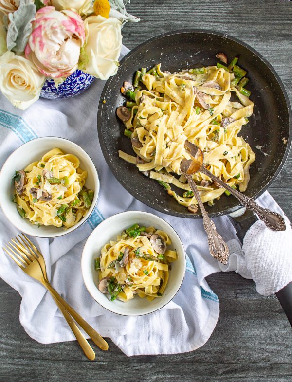 Creamy Pasta with Asparagus and Mushrooms is a meal that can be made in just 20 minutes. Fresh pasta is coated in a light parmesan and mascarpone sauce and tossed with sauteed mushrooms and al dente asparagus. Serve it as a complete meal or as a side dish.