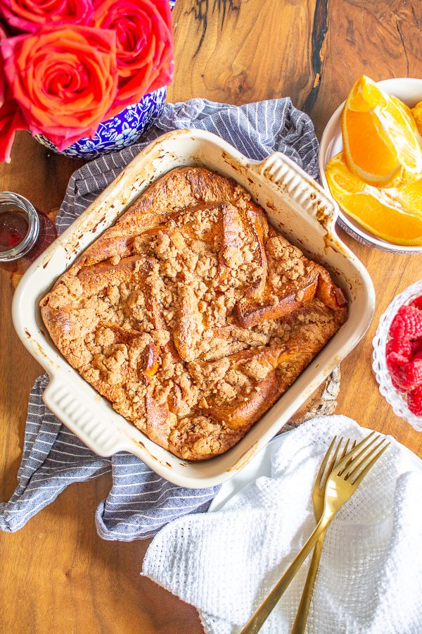 This Overnight Baked French Toast makes weekend mornings extra special. It's a decadent meal made with classic baked french toast topped with a cinnamon streusel topping. As it bakes, it fills your home with a delicious scent worth getting out of bed for.