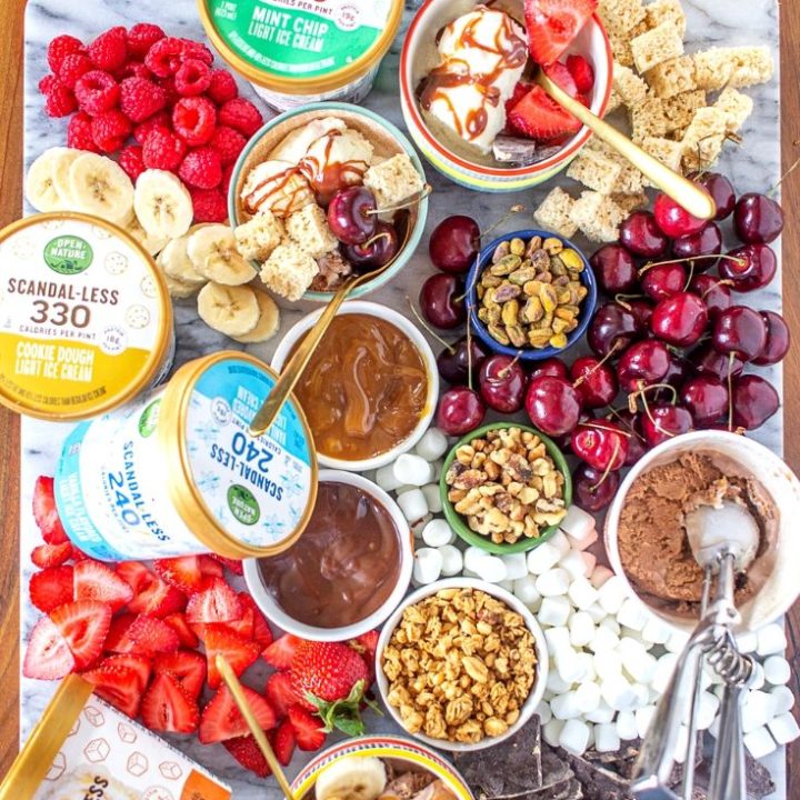 Learn how to make an ice cream dessert board with Open Nature® Scandal-less Light Ice Cream! It’s so easy and fun to create! I love the idea of serving this when you are watching a movie or television show with friends - everyone can grab a bowl and create their own personalized dessert that is perfect for them.