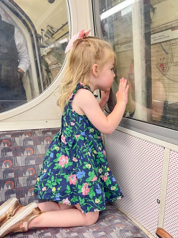 A guide to taking the London Underground with a toddler including how to navigate bringing a stroller and taking elevators.